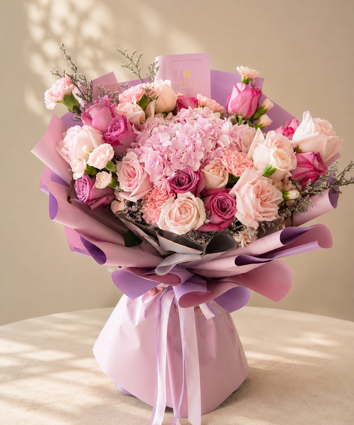 Luxury pink and lilac rose bouquet with hydrangea in layered pink wrapping, flower delivery Fes
