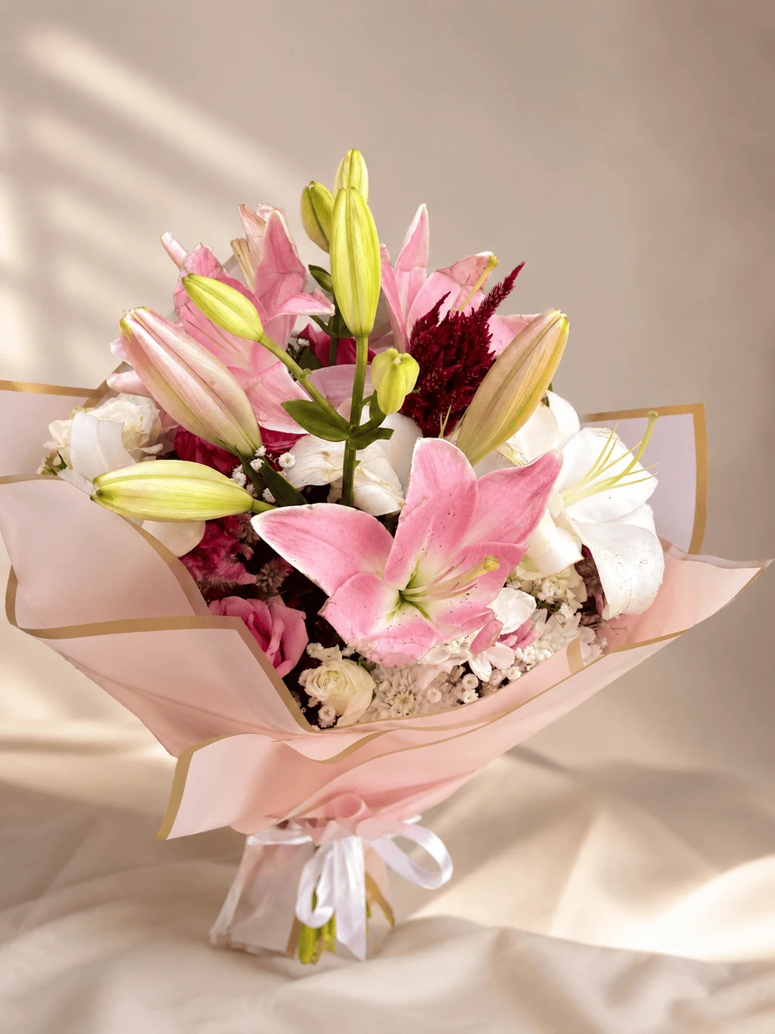 Pink lily bouquet with white blooms and burgundy accents, flower delivery Meknes