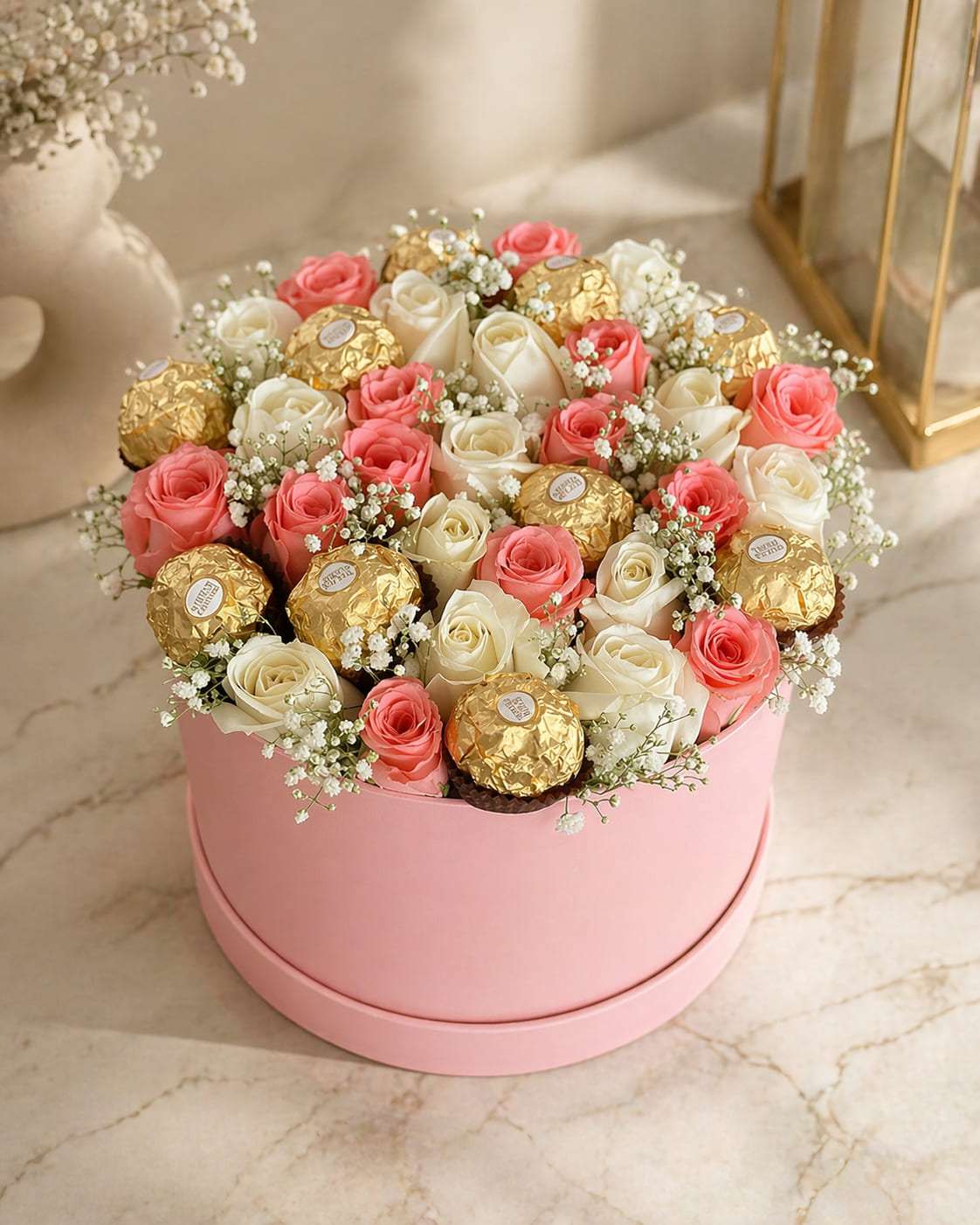 Pink hatbox of roses and Ferrero Rocher chocolates, gift delivery in Fes