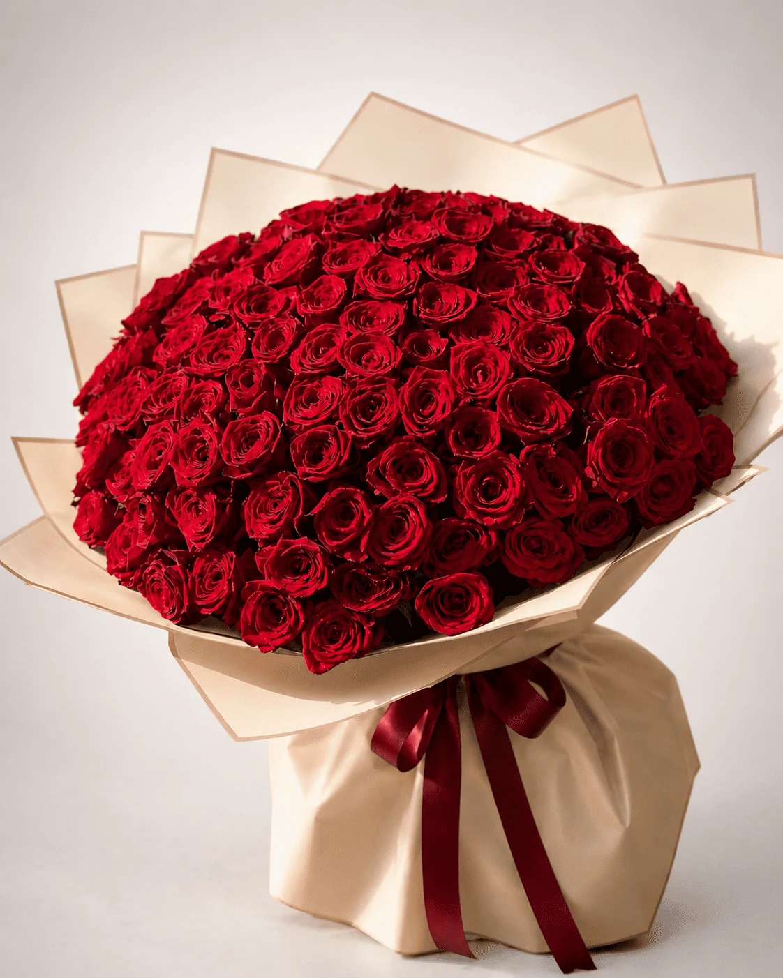Velvet Rouge Bouquet of deep red roses in ivory wrapping, available for delivery in Fes